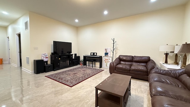 living room with recessed lighting, visible vents, marble finish floor, and baseboards