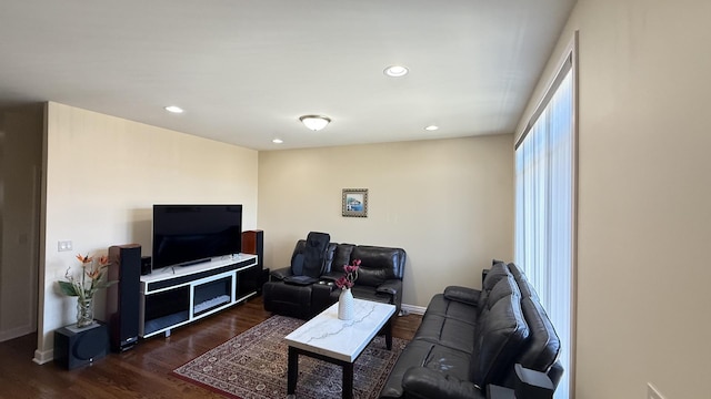 living room featuring recessed lighting and dark wood-style floors