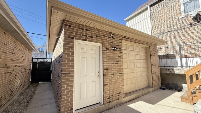 view of exterior entry with brick siding