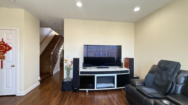 living area featuring stairway, recessed lighting, baseboards, and wood finished floors