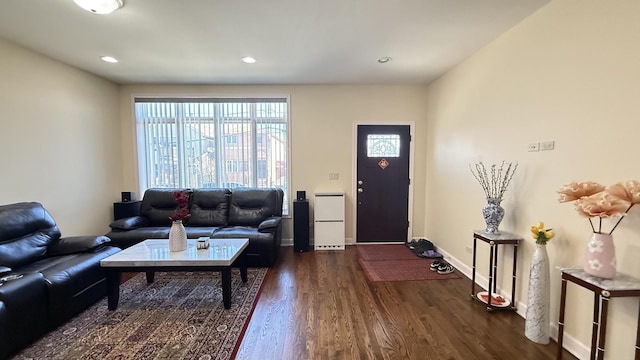 living room with recessed lighting, baseboards, and dark wood-style floors