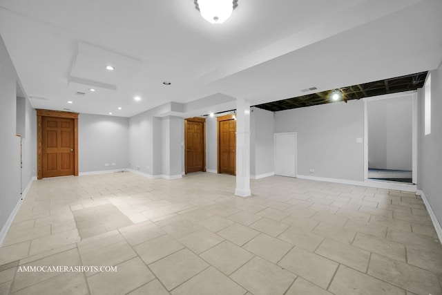 finished basement with recessed lighting, visible vents, baseboards, and light tile patterned floors