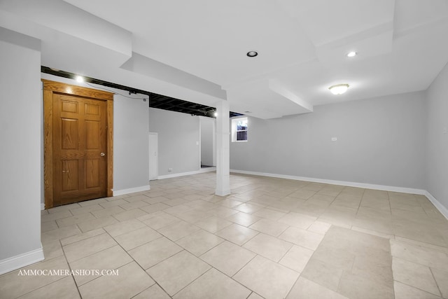 basement with light tile patterned floors, baseboards, and recessed lighting