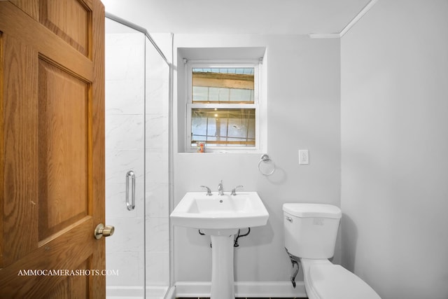 full bathroom with a shower stall and toilet