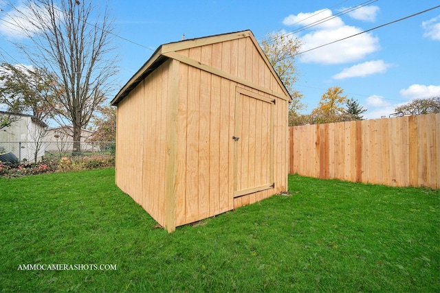 view of shed with a fenced backyard