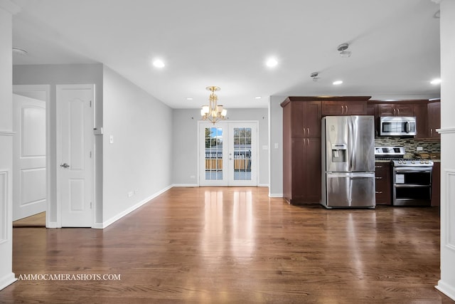 kitchen with stainless steel appliances, recessed lighting, dark wood-style flooring, and backsplash