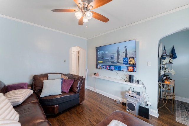 living room with ceiling fan, baseboards, wood finished floors, and crown molding