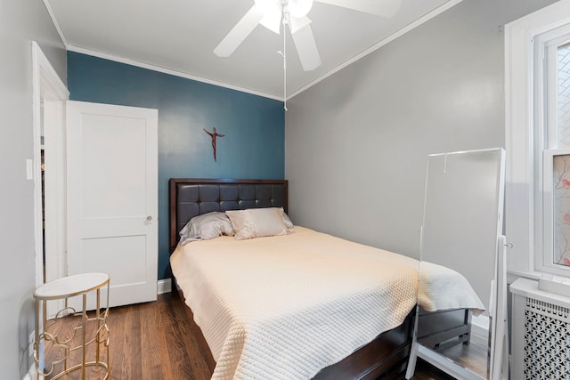 bedroom featuring radiator, wood finished floors, a ceiling fan, and ornamental molding