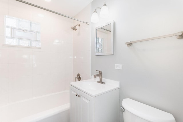 bathroom featuring toilet, washtub / shower combination, and vanity