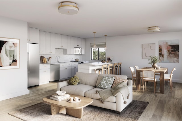 living room with light wood-type flooring and baseboards