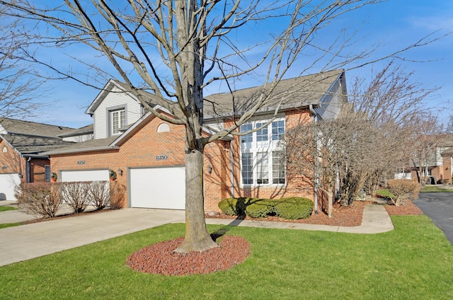 traditional-style home with brick siding, a shingled roof, a front lawn, concrete driveway, and a garage