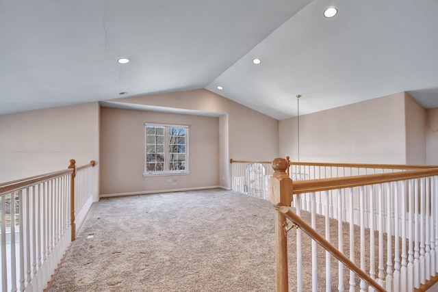 corridor with lofted ceiling, carpet flooring, recessed lighting, and baseboards