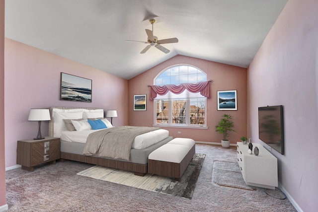 carpeted bedroom featuring baseboards, lofted ceiling, and ceiling fan