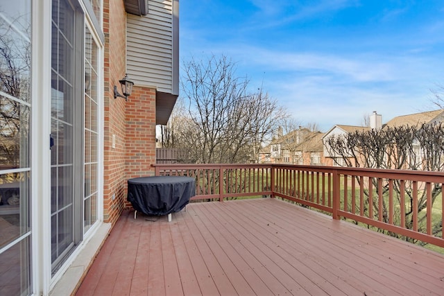 wooden terrace with a residential view