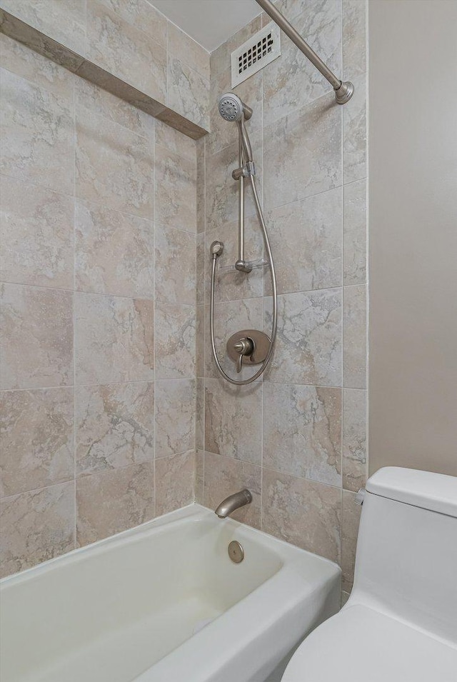 full bath with visible vents, toilet, and  shower combination