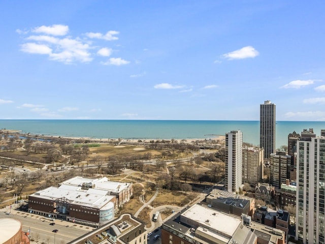 drone / aerial view featuring a water view and a city view