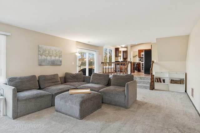 living area with light colored carpet