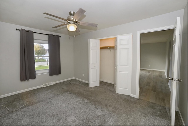 unfurnished bedroom featuring visible vents, baseboards, ceiling fan, carpet flooring, and a closet