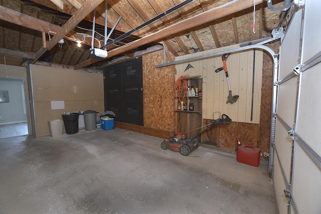 garage featuring a workshop area and a garage door opener