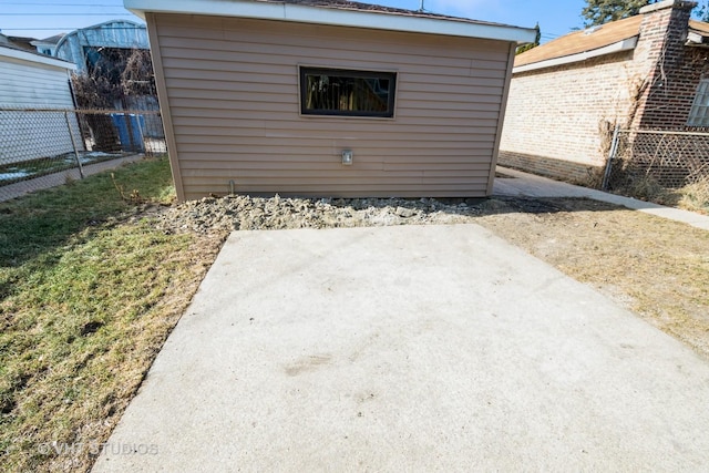 exterior space with an outbuilding and fence