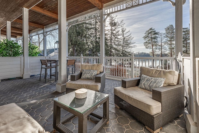 view of patio / terrace featuring an outdoor living space and a water view