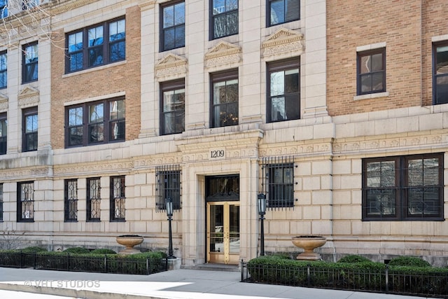 view of building exterior with fence