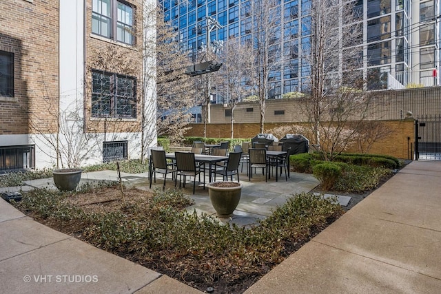 view of patio / terrace featuring outdoor dining space and grilling area