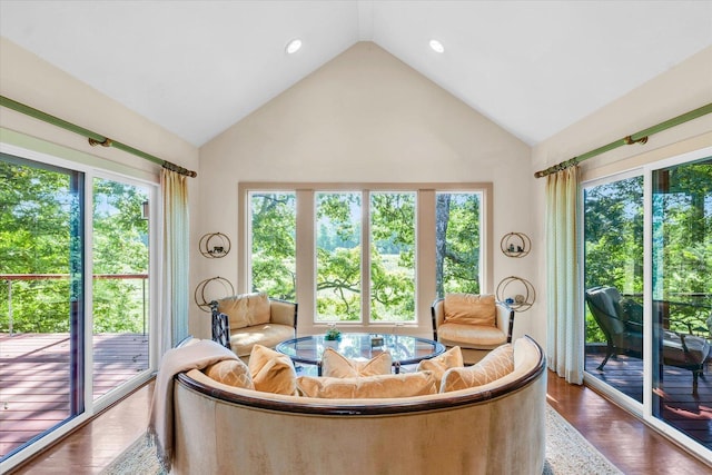 sunroom / solarium featuring vaulted ceiling