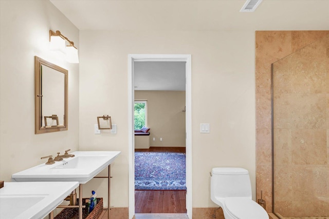 full bathroom featuring a shower stall, toilet, visible vents, and ensuite bathroom