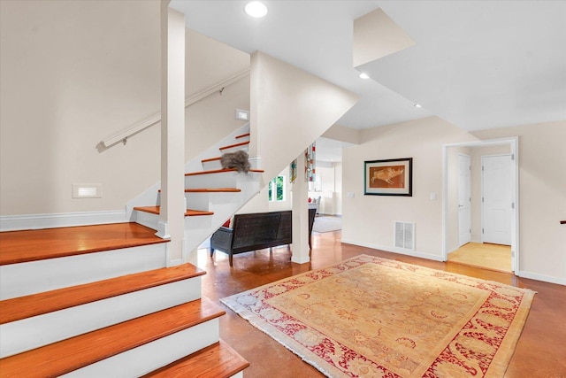 stairs featuring recessed lighting, visible vents, and baseboards