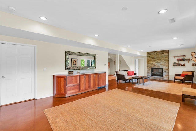 interior space featuring recessed lighting, visible vents, baseboards, and a fireplace