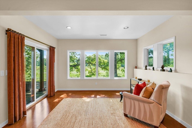 living area featuring visible vents and baseboards