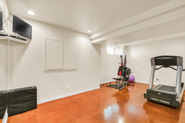 exercise room with recessed lighting and baseboards