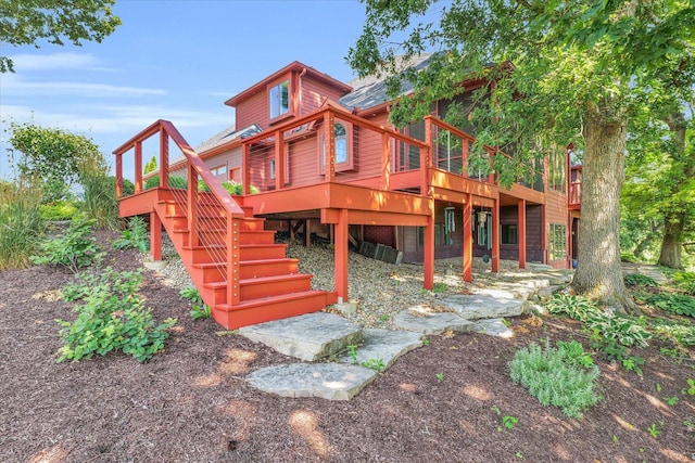 view of jungle gym with a deck and stairs