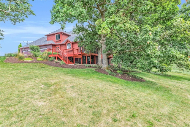 view of yard with a deck and stairway