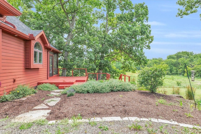 view of yard featuring a wooden deck