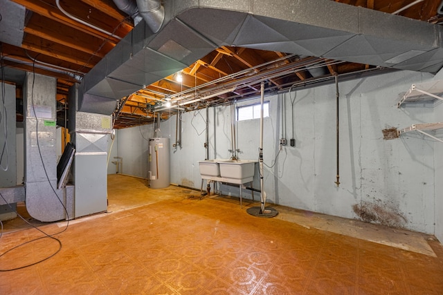 below grade area featuring water heater, heating unit, tile patterned floors, and a sink