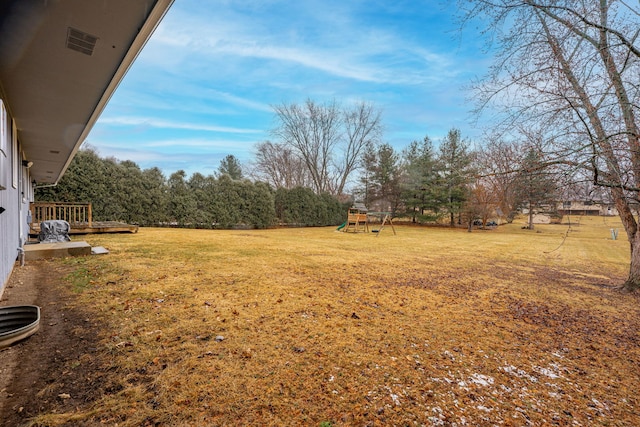 view of yard with a playground and visible vents