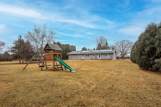 view of playground featuring a lawn