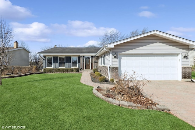 single story home with brick siding, an attached garage, decorative driveway, and a front lawn