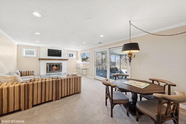 dining space with baseboards, recessed lighting, a fireplace, ornamental molding, and light colored carpet