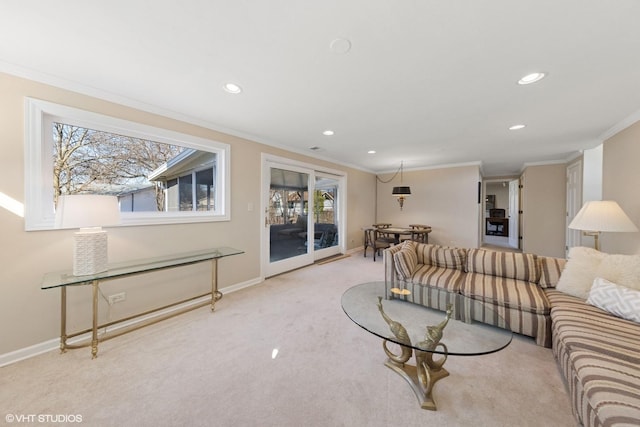 carpeted living area featuring recessed lighting, baseboards, and crown molding