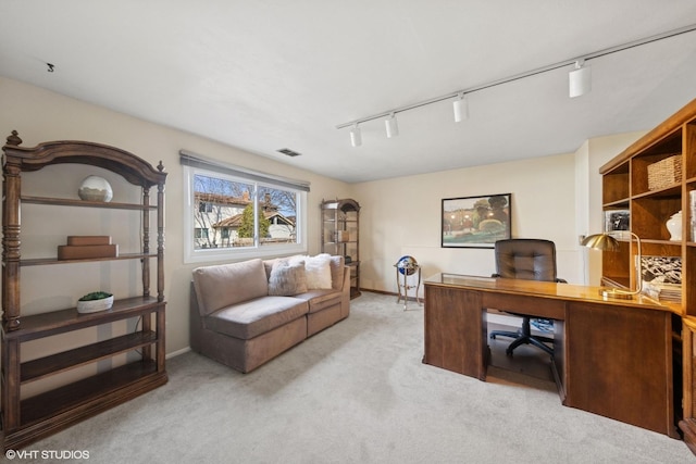 office area featuring visible vents, carpet flooring, rail lighting, and baseboards