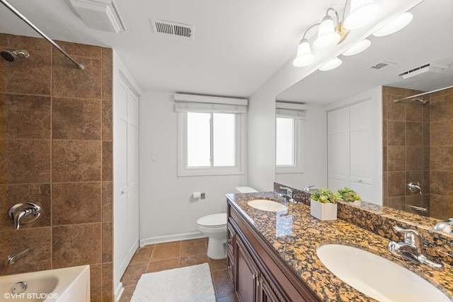 bathroom with shower / bathing tub combination, visible vents, tile patterned floors, and a sink