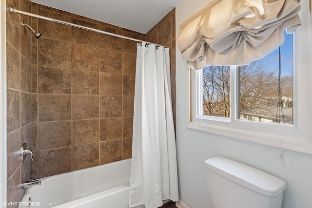 full bath featuring toilet and shower / bathtub combination with curtain