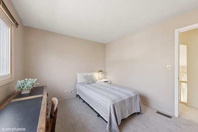 bedroom with carpet flooring, baseboards, and visible vents