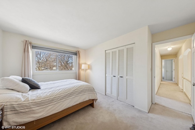 bedroom with a closet and carpet flooring