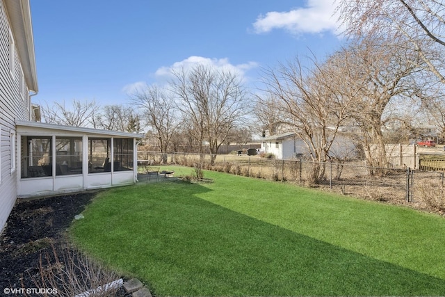 view of yard with a fenced backyard and a sunroom