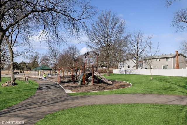 community playground with a gazebo, a lawn, and fence