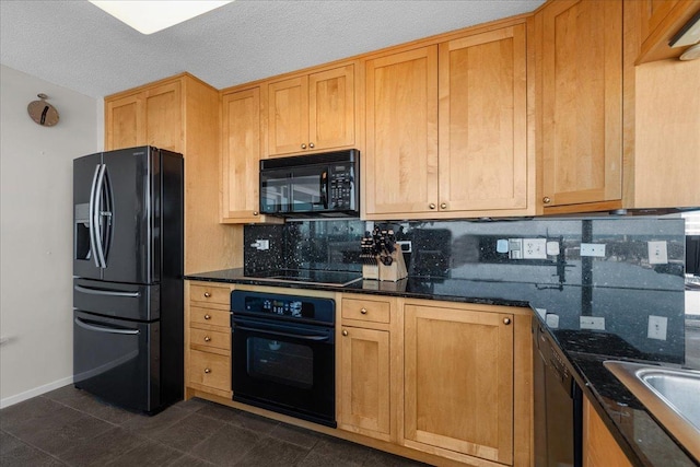 kitchen with dark stone countertops, baseboards, black appliances, a textured ceiling, and tasteful backsplash